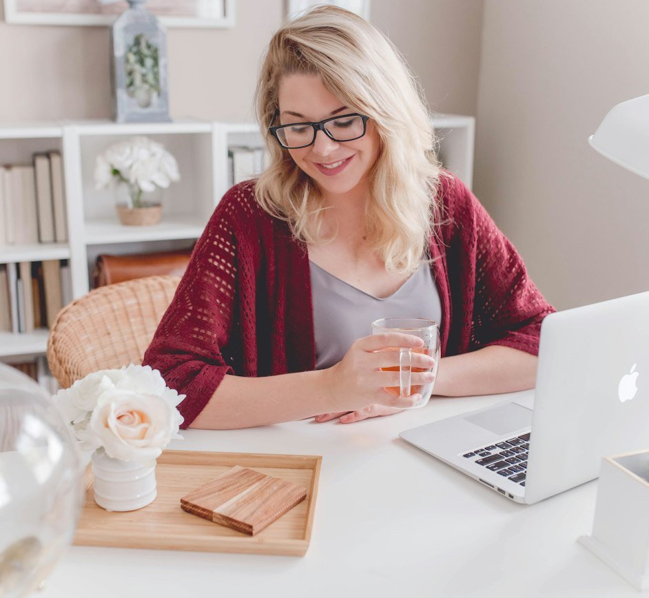 Smiling woman working from home on her laptop